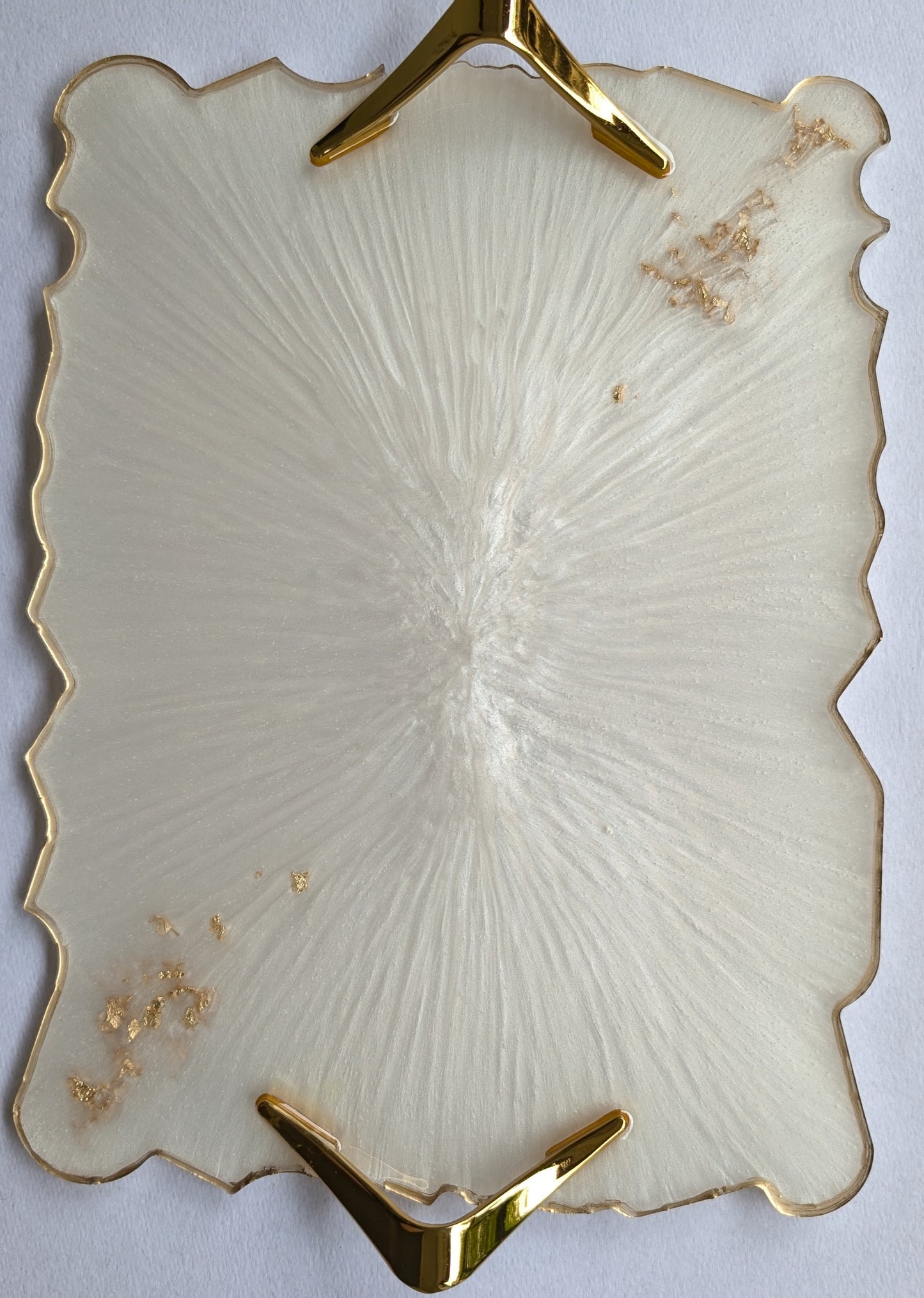 Decorative plate with gold accents on a white background
