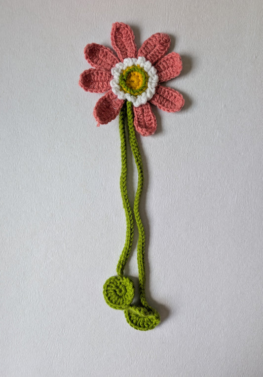 Crocheted flower curtain tie-up on a white background