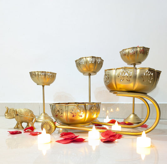 Handcrafted metal urli set with lotus cutwork and candle stands in gold finish