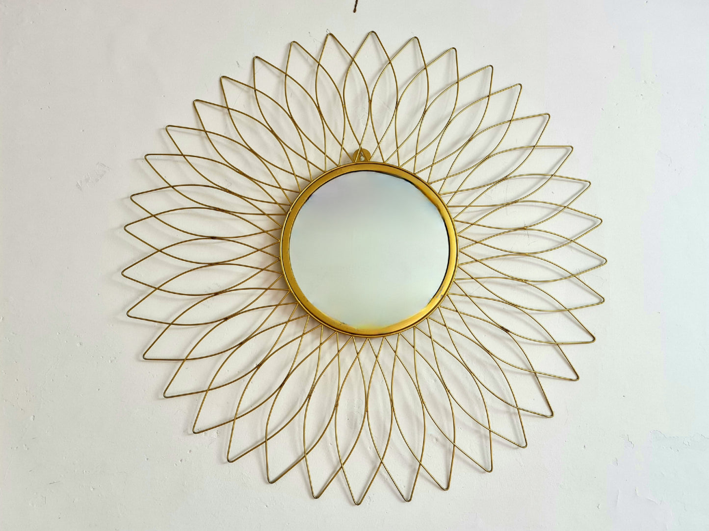 Decorative golden metal wall mirror